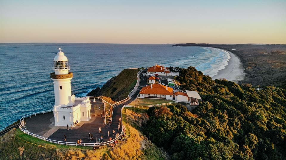 Cape Byron lighthouse above the coastline at sunset — the Northern Rivers, where Skiply is based